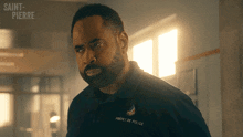 a man with a beard wearing a saint-pierre uniform