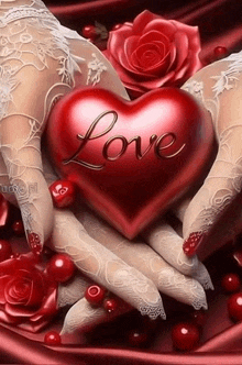 a woman is holding a red heart with the word love written on it