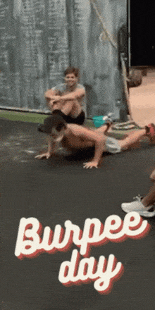 a picture of a man doing push ups with the words burpee day on the bottom