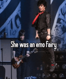 a man singing into a microphone while another man plays a guitar with the caption she was an emo fairy