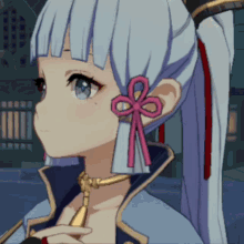 a close up of a girl 's face with a red bow on her ear