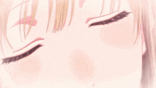 a close up of a woman 's face with her eyes closed and a pink flower on her forehead
