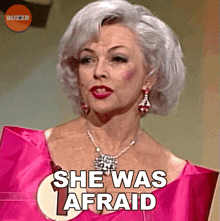 a woman in a pink dress with the words she was afraid below her