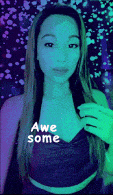 a woman in a purple top with the words awe some written on her chest