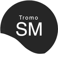 a black circle with the word tromo sm written on it