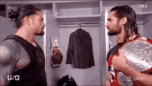 Roman Reigns Seth Rollins GIF - Roman Reigns Seth Rollins Reaction GIFs
