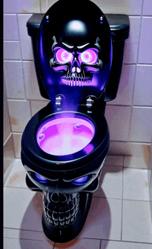 a black toilet with a skull on the seat