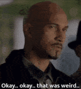a bald man with a beard and mustache says " okay okay that was weird "