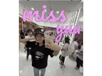 a woman taking a selfie in front of a mirror with the words miss you written above her