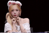 a girl wearing a cat ear headband says lost in on the bottom