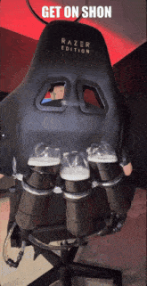 a picture of a razer edition chair with beer bottles attached to the back
