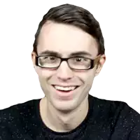 a man wearing glasses and a black shirt smiles at the camera