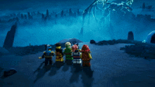 a group of lego figures standing in front of a giant dragon