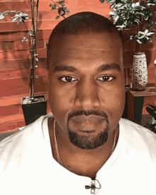 kanye west rapper serious bald stare