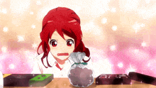 a girl with red hair is looking at a bag of chocolate