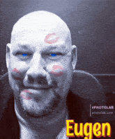 a bald man with a beard has a kiss on his face and the name eugen is on the bottom