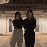 two women standing next to each other with one wearing a waistband that says adnsaintz bony