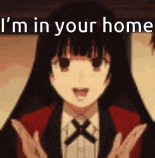 a girl is standing in front of a sign that says `` i 'm in your home '' with her hands in the air .