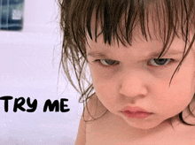 a baby in a bathtub with the words " try me " written on the bottom