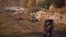 a purple monster truck is driving down a dirt track