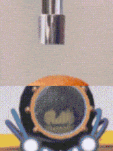 a close up of a cartoon character 's helmet with a green face