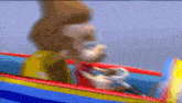 a blurry picture of a cartoon character riding an inflatable boat .