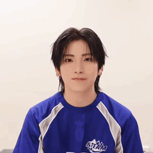 a boy wearing a blue shirt that says steam