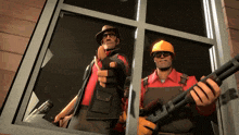 a man in a hard hat holds a shotgun next to another man in overalls