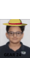 a boy wearing glasses and a hat with gear 24 written on the bottom