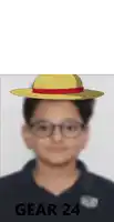 a boy wearing glasses and a hat with gear 24 written on the bottom