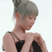 a woman with green hair is holding a purse with her eyes closed