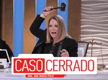 a woman is holding a gavel in front of a case cerrado sign