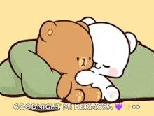 a couple of teddy bears are hugging each other on a bed .