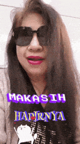 a woman wearing sunglasses has the words " makasih haprinya " on her face