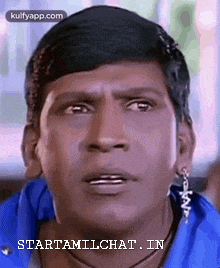 a close up of a man 's face with the words starttamilchat in written on the bottom .