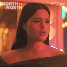 a close up of a woman 's face with the words north of north in the background