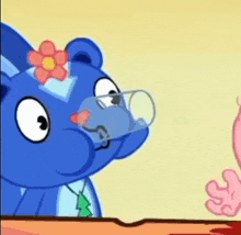 a cartoon bear with a flower on its head is drinking from a glass .