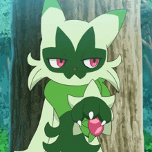 a green and white cat with red eyes is holding a pink object in its paw