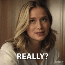 a woman with blonde hair says really in a netflix ad