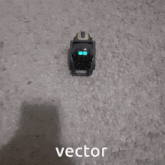a blurred image of a black object with the word vector written below it