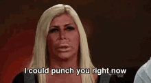 a woman with a very large nose is talking about punch you right now .