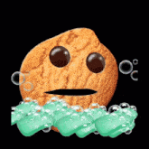 a cookie with a face is surrounded by green soap bubbles on a black background