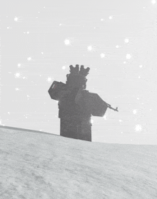 a silhouette of a person standing in the snow with a rifle
