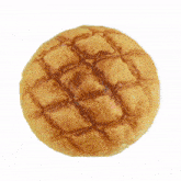 a close up of a melon bread on a white surface