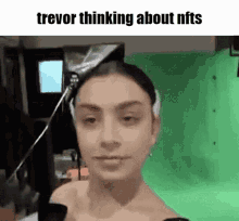 a woman with a bandage on her head is thinking about nfts .