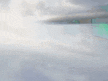 a fighter jet is flying through the air with a green background