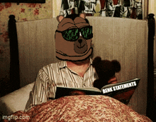 a man reading a book called benk statements