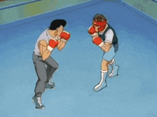 a boxing ring with a red rope and a punching bag