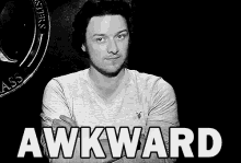 a black and white photo of a man with the word awkward written in white