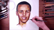 a drawing of a man 's face is being drawn with a prismacolor colored pencil